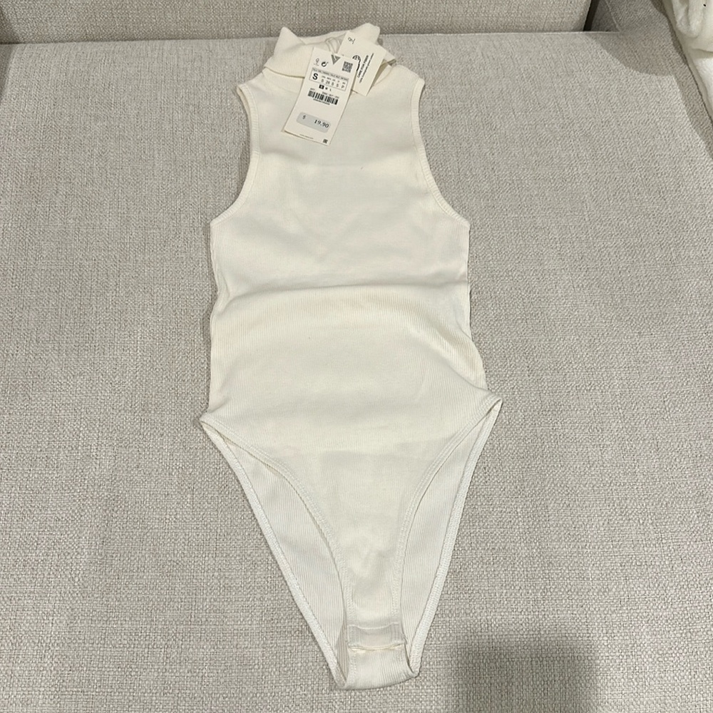 Zara crème turtle neck body suit.